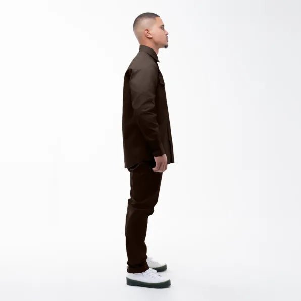 Men's Dickies 847 trousers in chocolate brown, showing a relaxed fit with sturdy fabric and classic workwear style.