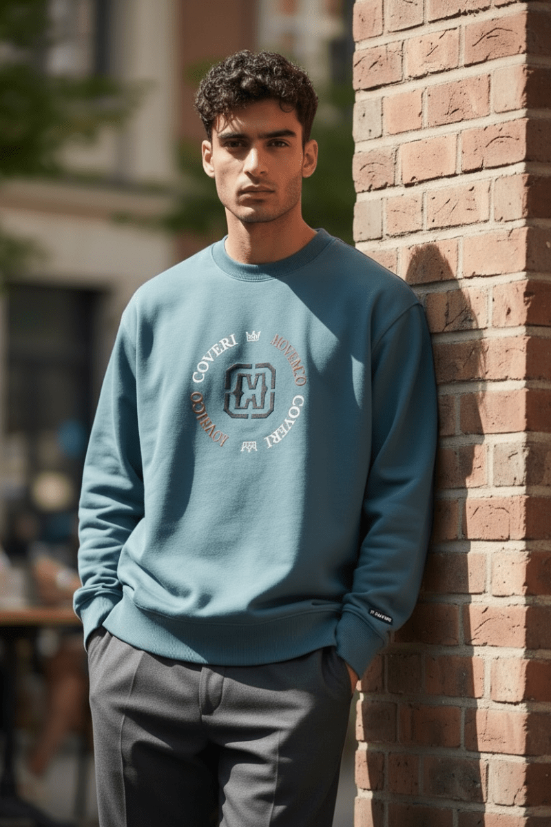 Enrico Coveri men's sweater in petrol blue, showcasing a knit texture and classic fit, designed for stylish casual wear.