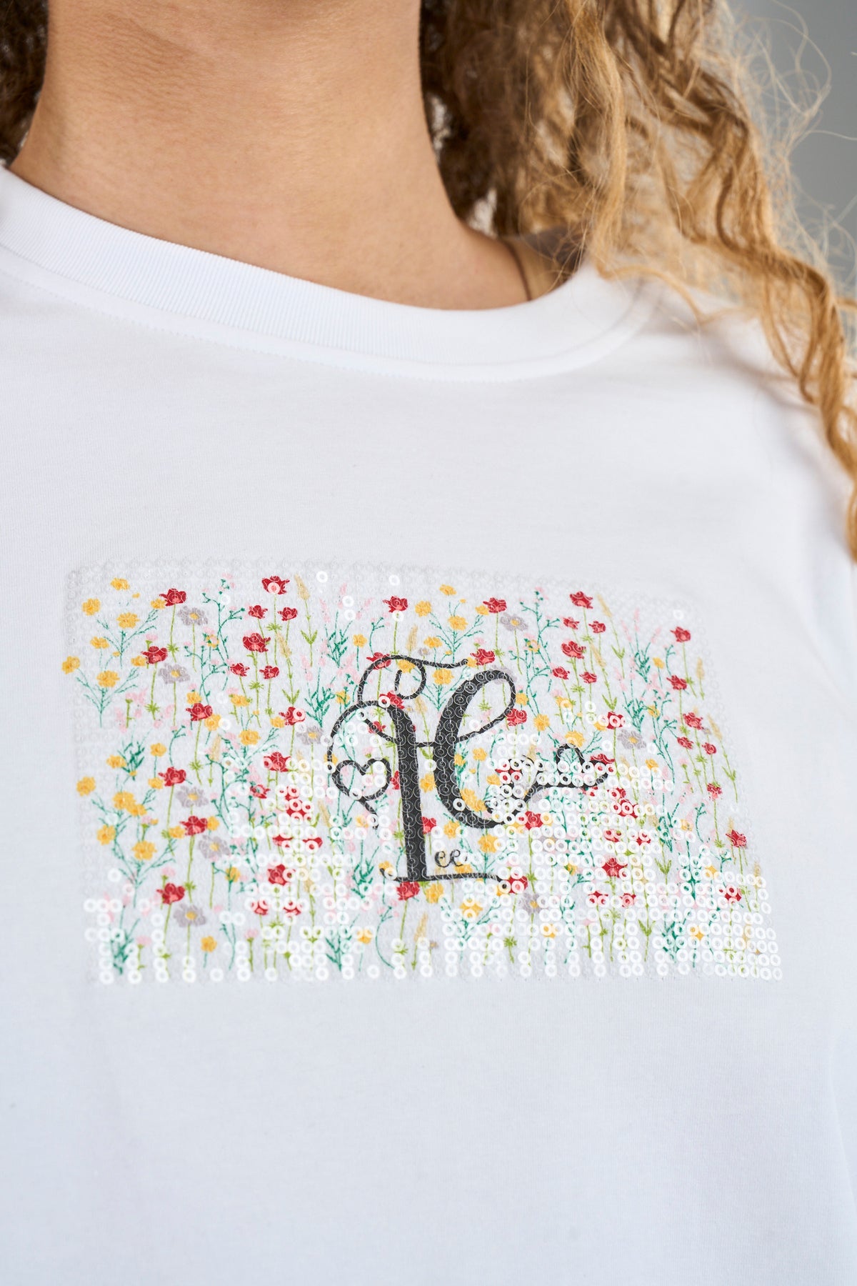 White Lee Cooper Blythe women's T-shirt displayed on a hanger, showcasing a casual fit and classic style.