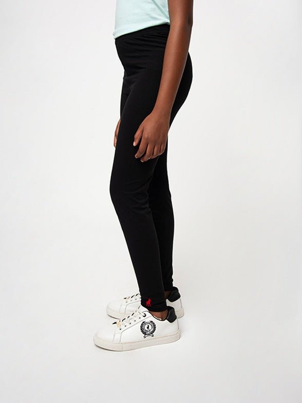 Black Polo girls Victoria full-length leggings for kids, shown on a young girl, featuring a comfortable fit and classic style.