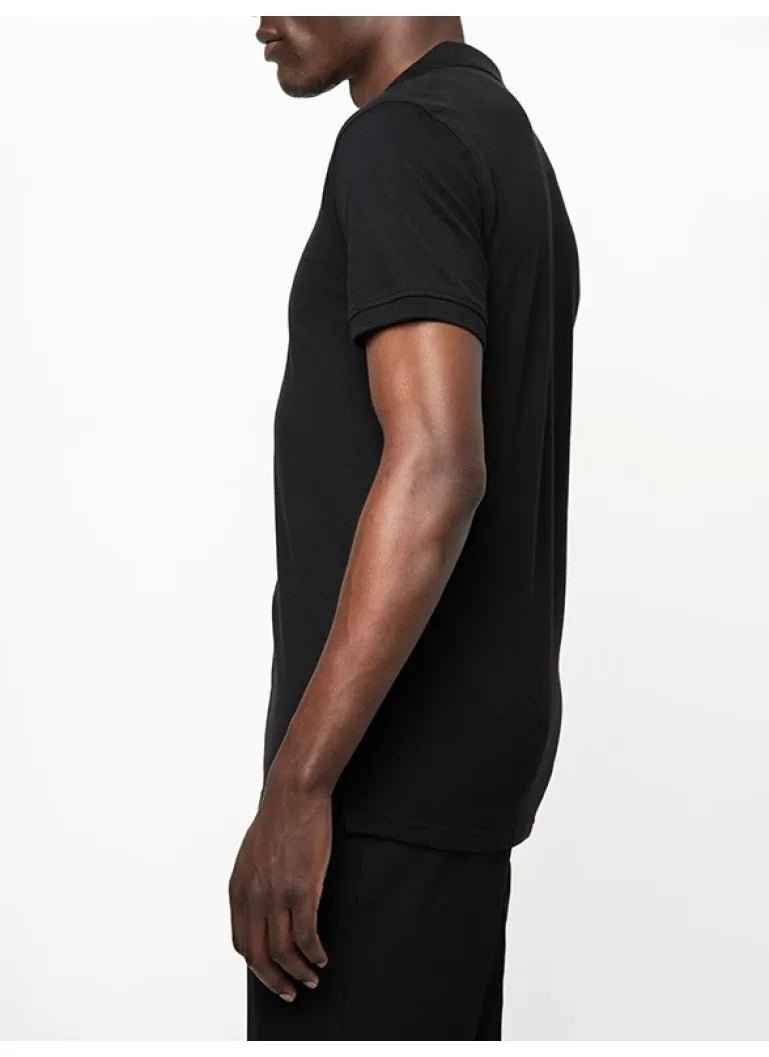 Black Polo men's stretch pique golfer shirt displayed on a hanger, showcasing its classic polo collar and comfortable fit.