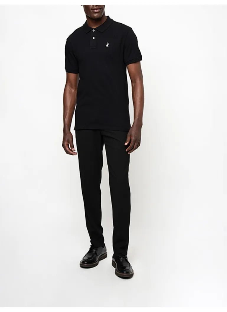 Black Polo men's stretch pique golfer shirt displayed flat, showing the classic fit and textured fabric.