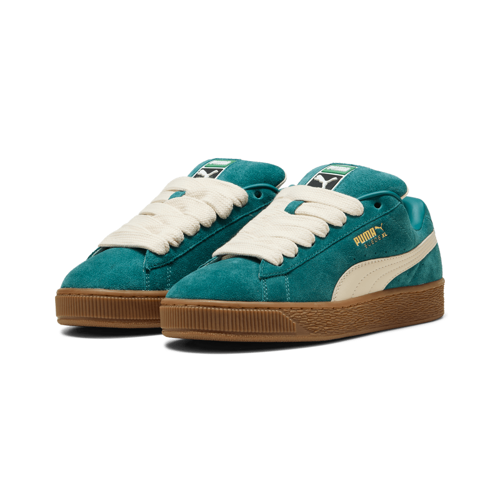 Puma men's Suede XL sneakers in black with white soles, featuring classic suede material and stylish design.