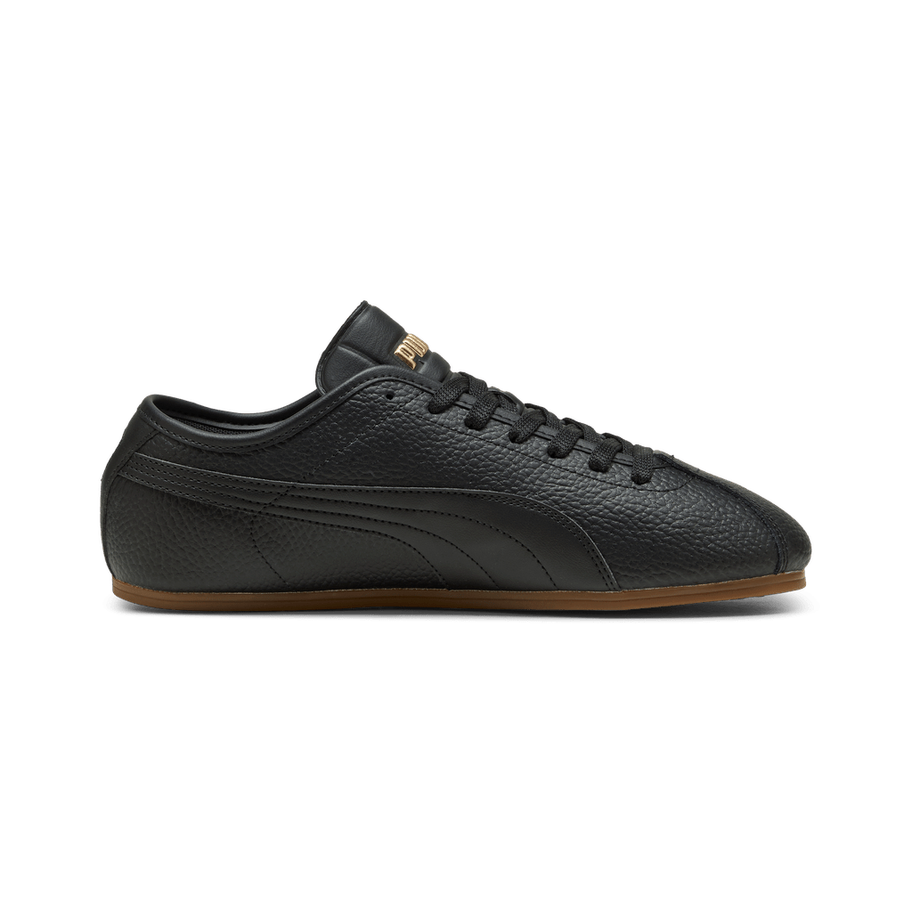 Puma men's Tackle L sneakers in black, gold, and gum colorway, featuring sporty design and Puma branding.