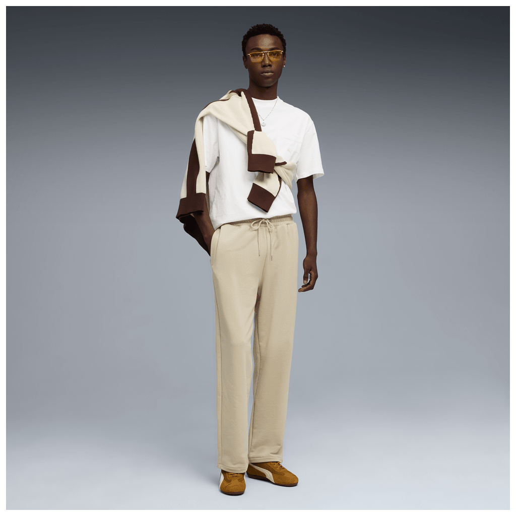 Puma men's Wardrope ESS relaxed sweatpants in black with Puma logo, comfortable track pants for casual wear.