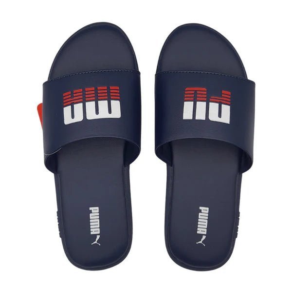Puma Kids Sporty Slide ZADP 405442-01 sandals in black with Puma logo, featuring comfortable slip-on design for active kids.