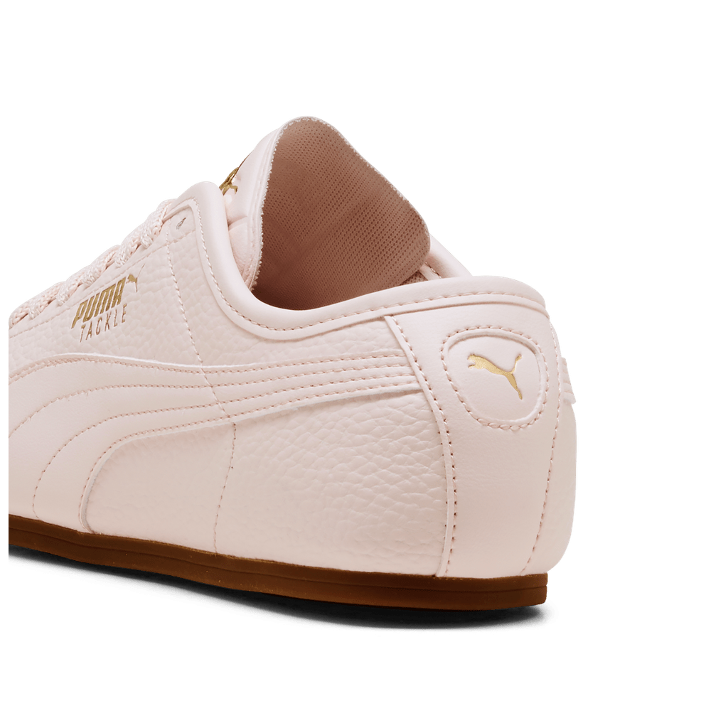 Puma Womens Tackle L sneakers in black and white with sporty design, featuring Puma branding and cushioned soles.