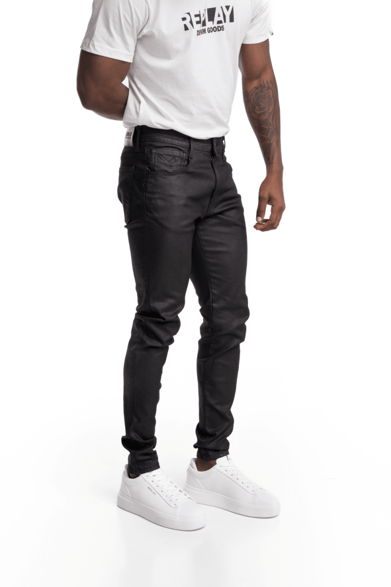 Replay Bronny Wax Denim Men's Jeans in black with badges, showcasing a slim fit and stylish distressed details.