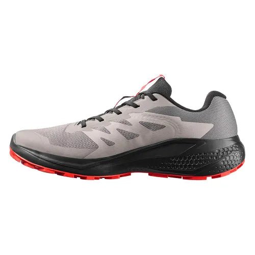 Men's Salomon Alphaglide Cloudburst sneakers in black with fiery red accents, showcasing the sporty design and breathable material.