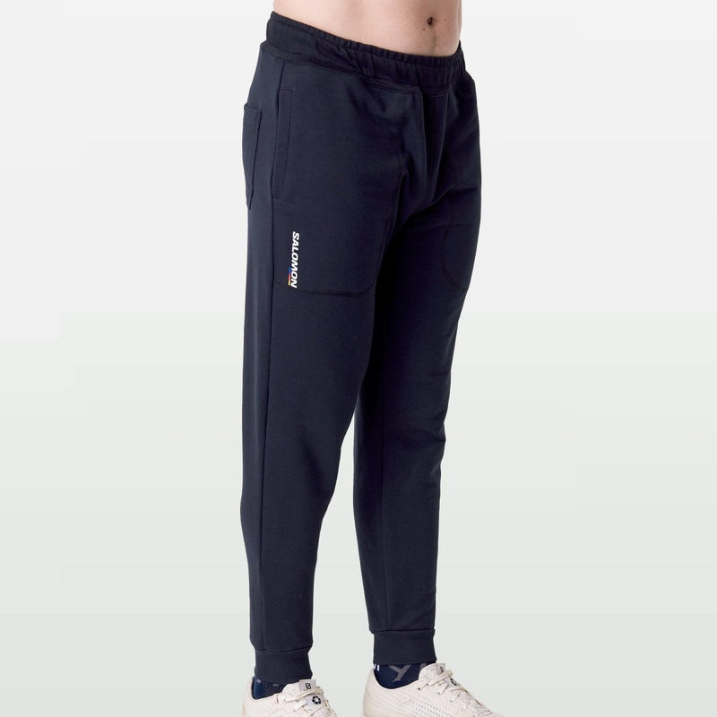 Black Salomon Racer Fleece Pant for women, featuring a comfortable fleece material and athletic fit.