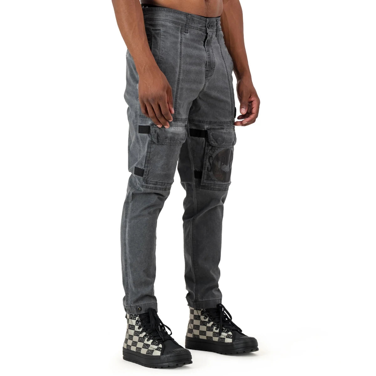 Men's SPCC Alden Cargo Black jeans with multiple pockets and sturdy fabric, displayed folded with a focus on the cargo style.