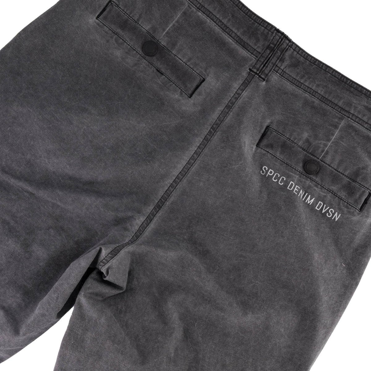 Black SPCC Alden cargo jeans for men, showing the relaxed fit and multiple cargo pockets on durable denim fabric.