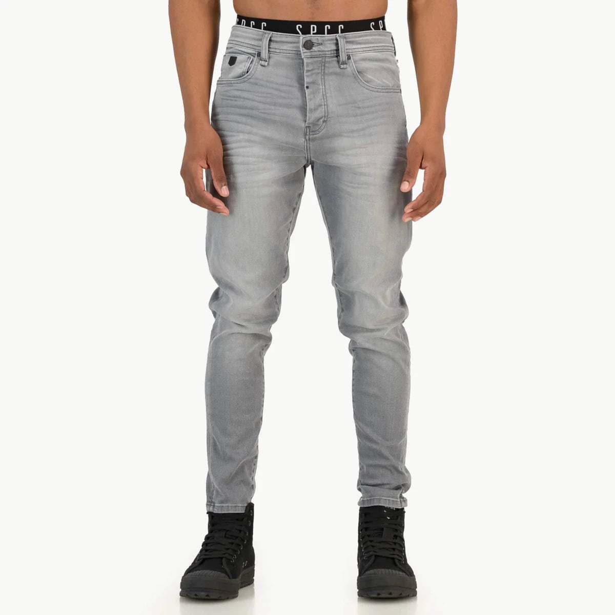 Mens SPCC Asphalt Jeans in washed grey fabric, showing a relaxed fit with a classic five-pocket design and subtle branding details.