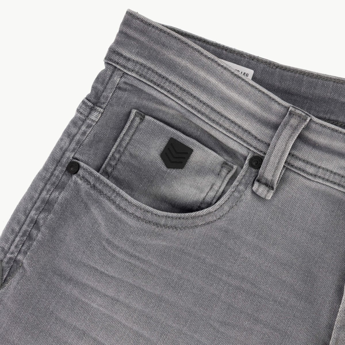 Mens SPCC Asphalt Jeans in washed grey with classic fit and distressed details, showcasing durable denim and casual style.