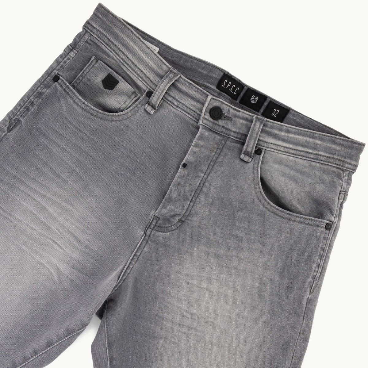 Men's SPCC Asphalt Jeans in washed grey with a classic fit and denim texture, displayed on a neutral background.