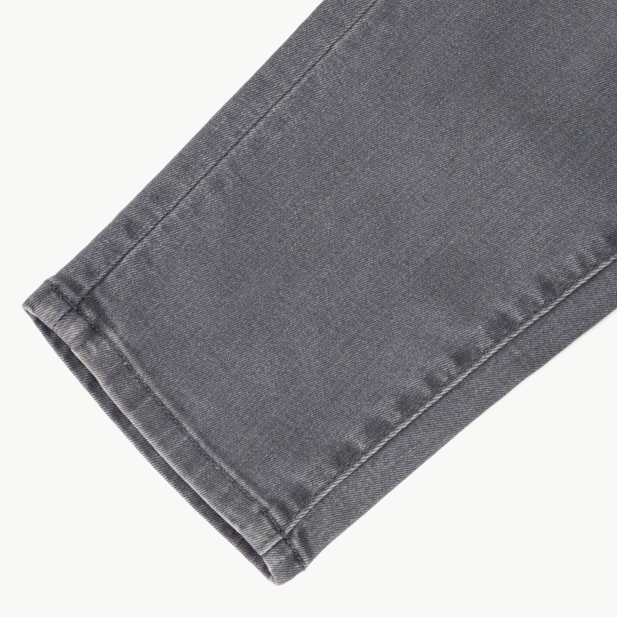 Men's SPCC Asphalt Jeans in washed grey denim, featuring a classic fit and detailed stitching, perfect for casual wear.