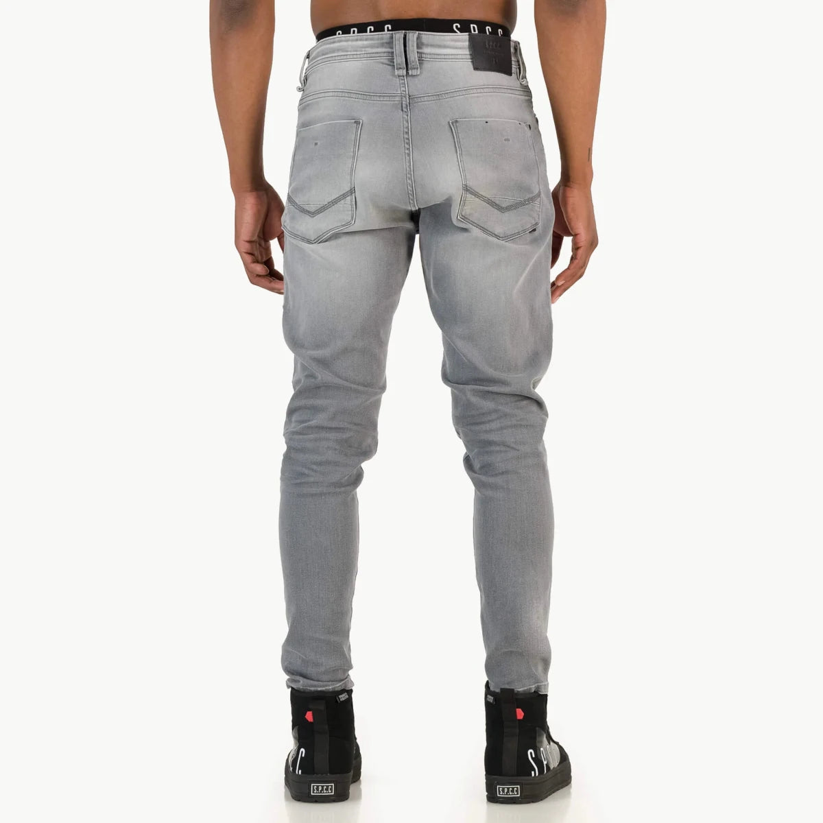 Men's SPCC Asphalt Jeans in washed grey with a slim fit, featuring classic five-pocket design and distressed details.