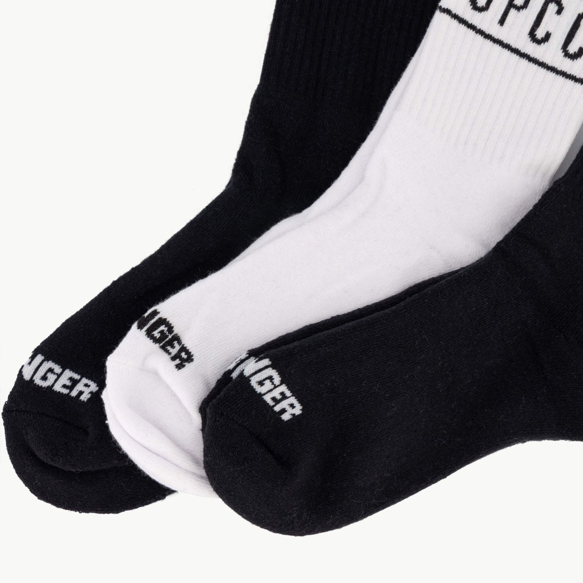 Set of three SPCC Declen men's socks in black and white, casual athletic style, shown in a close-up image.