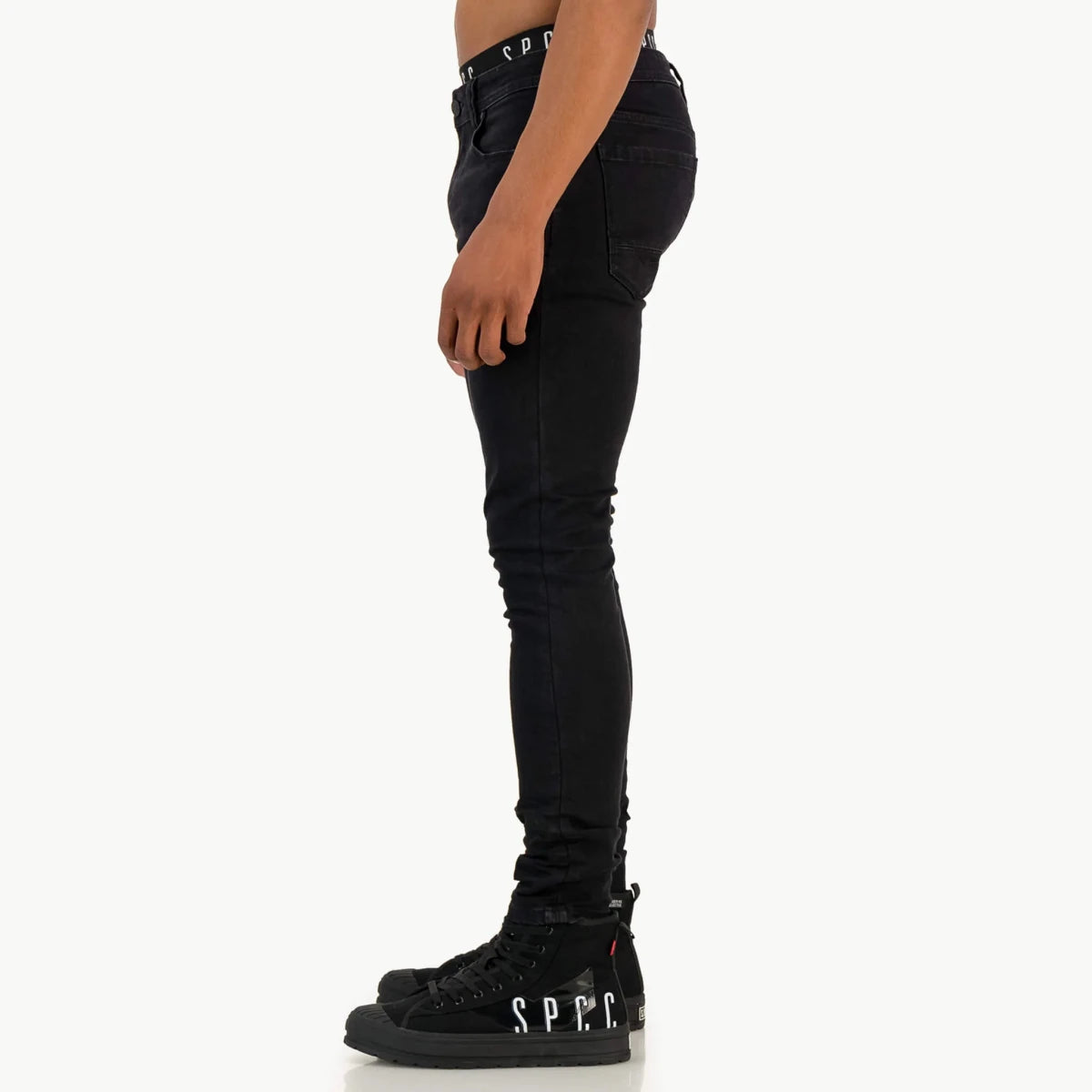Black SPCC Onyx men's jeans with a slim fit and classic five-pocket design, shown on a model.