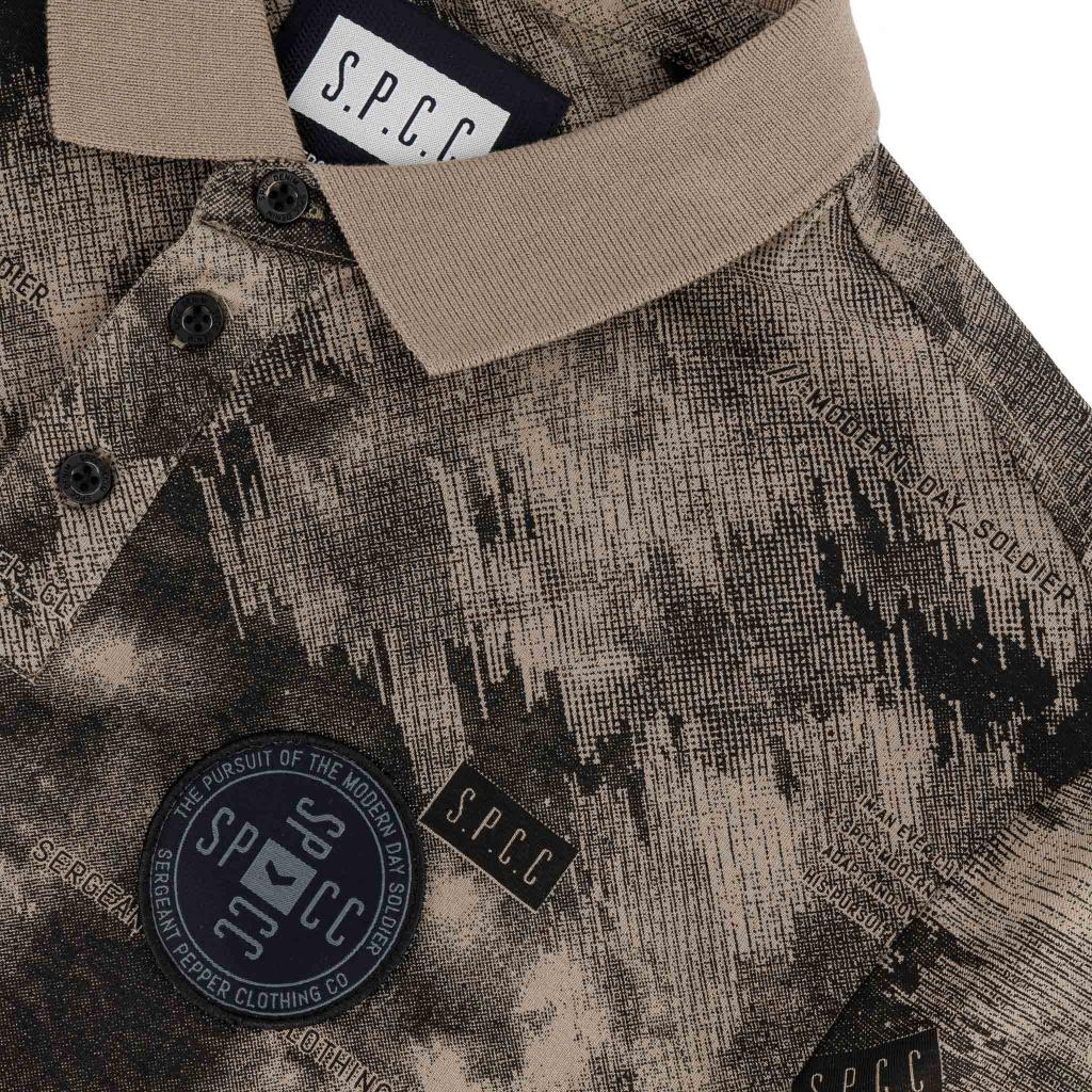 Men's golfer shirt by SPCC in stone color, featuring a classic polo design with a collar and short sleeves.