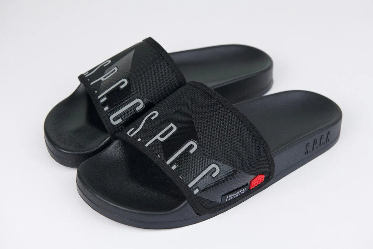 Men's SPCC Surge Dusk Slider sandals in black with cushioned straps and a textured sole for comfortable summer wear.