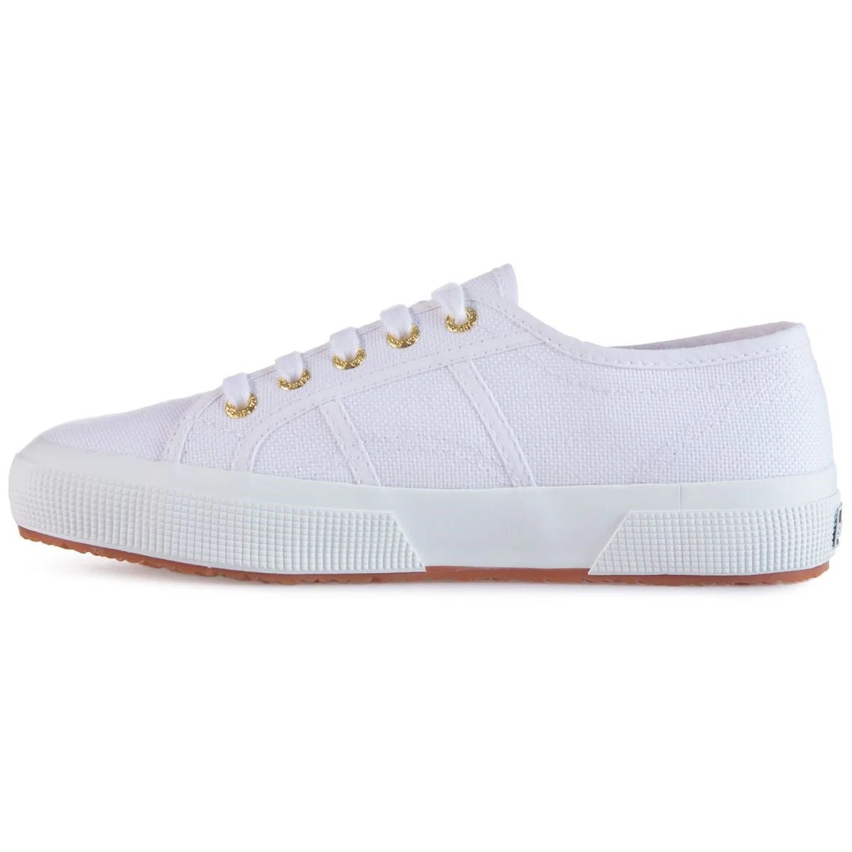 Pair of Superga 2750 women's sneakers in white with pale gold accents, showcasing classic canvas design and stylish comfort.
