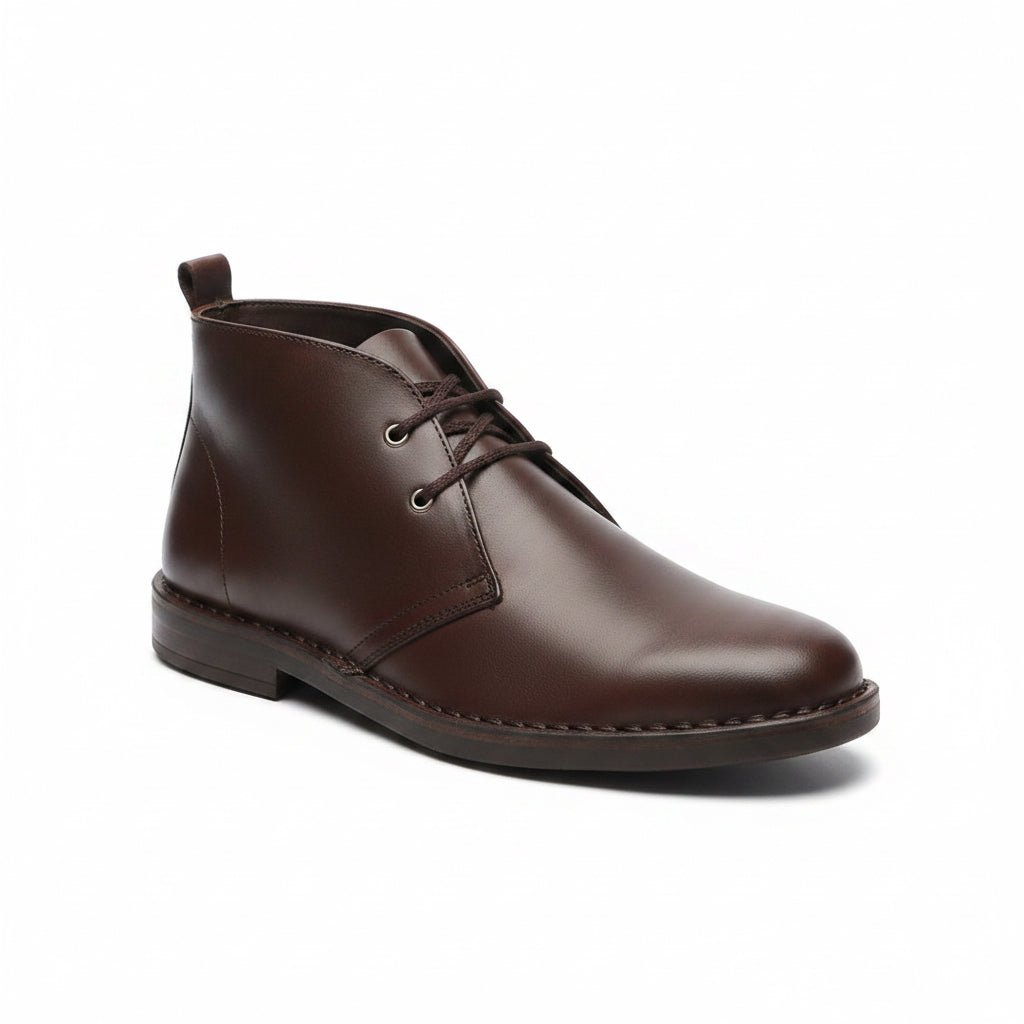 Brown Tego Vellies leather men's boots with sleek design and sturdy sole, showcasing fine craftsmanship and stylish silhouette.