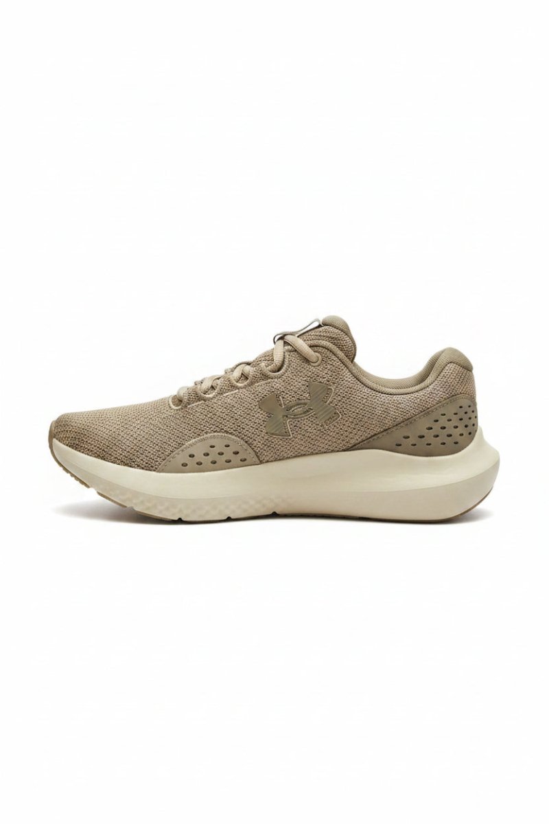 Under Armour Charged Surge 4 men's sneakers in brown, showcasing a comfortable athletic shoe with breathable mesh and cushioned sole.
