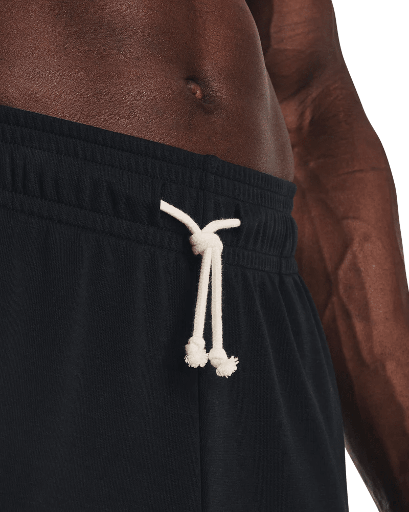 Black Under Armour Rival Terry men's joggers with elastic waistband and cuffed ankles, made from soft, comfortable terry fabric.
